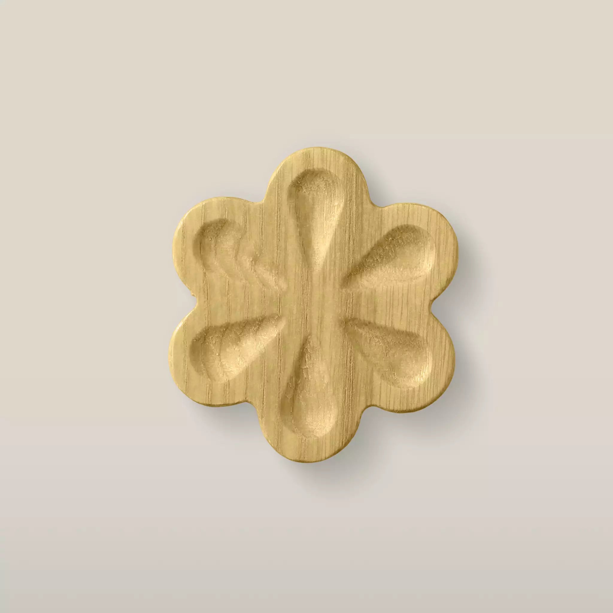 Solid ash carved flower cabinet knob in the Cream finish, front view