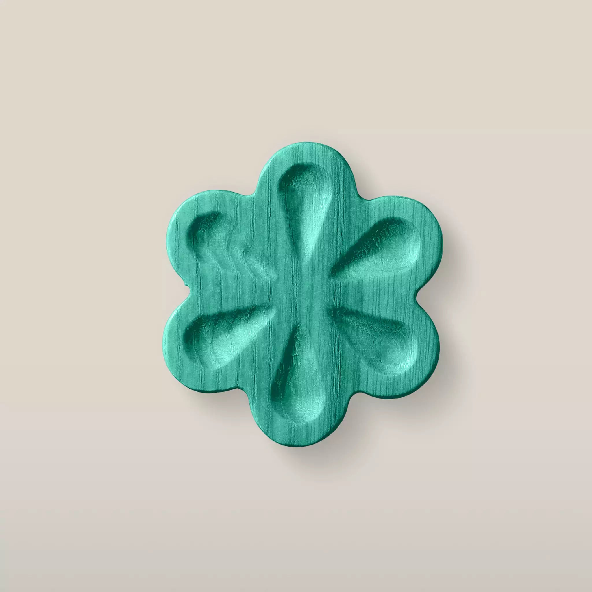 Solid ash carved flower cabinet knob in the Green finish, front view
