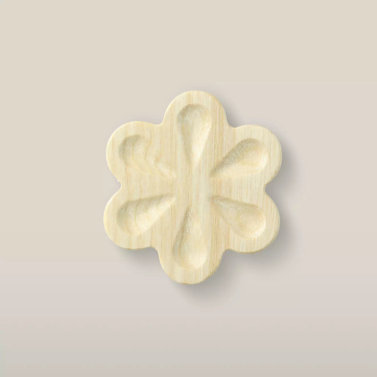 Solid ash carved flower cabinet knob in the Latte finish, front view