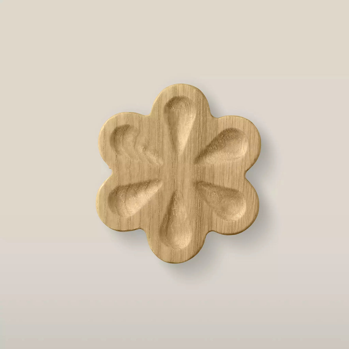 Solid ash carved flower cabinet knob in the Oiled finish, front view