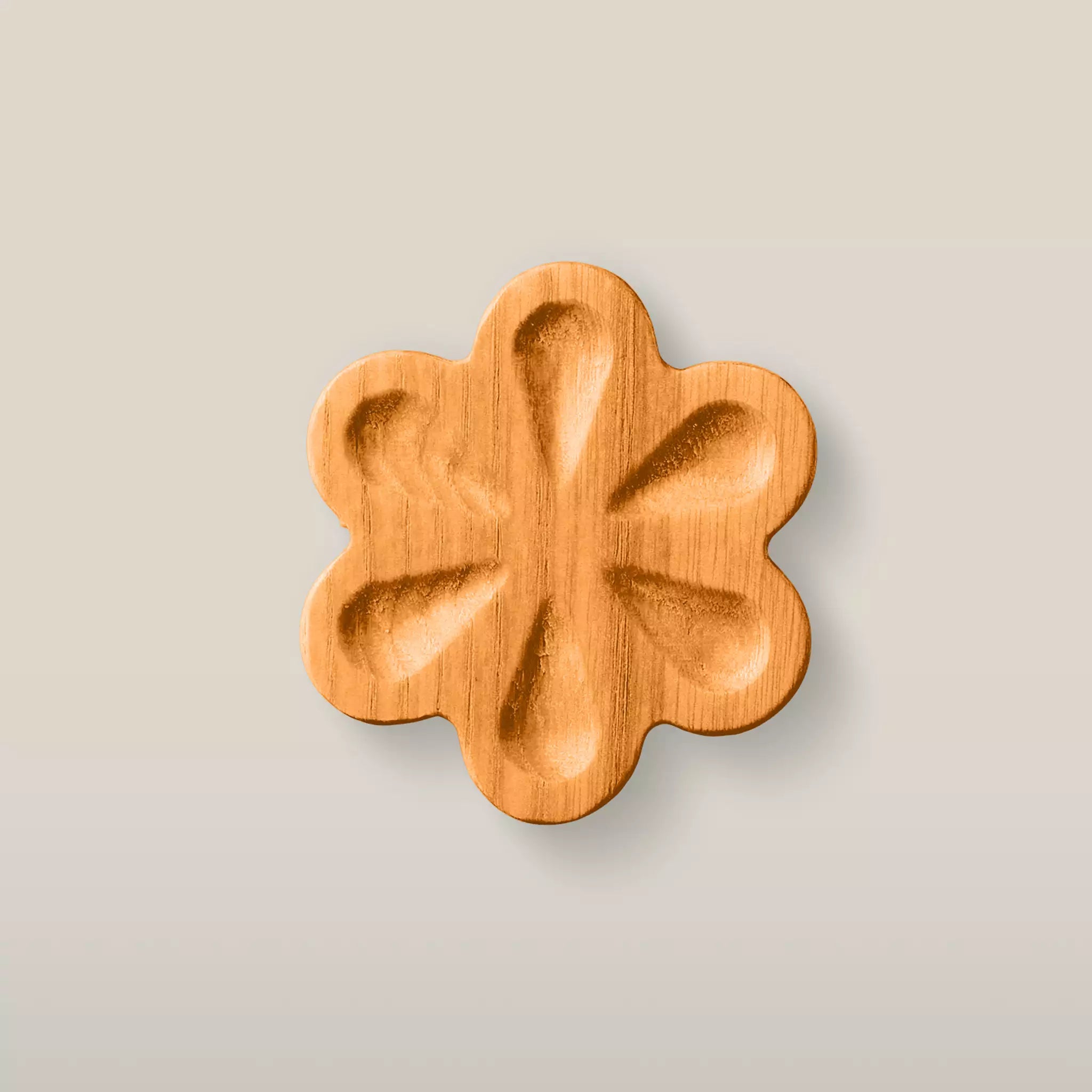 Solid ash carved flower cabinet knob in the Orange finish, front view