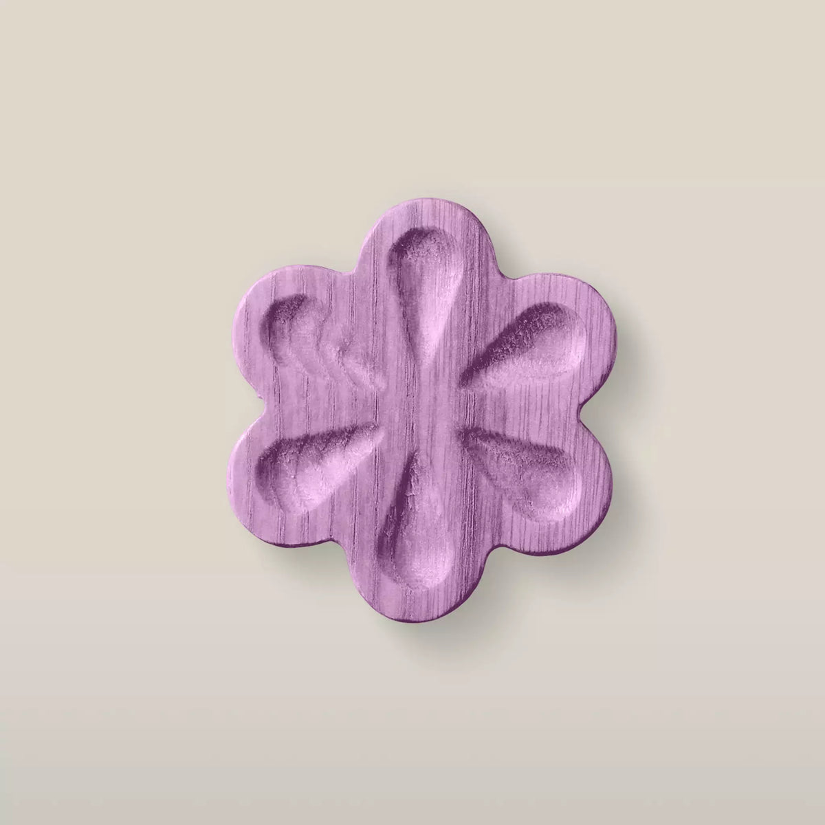 Solid ash carved flower cabinet knob in the Purple finish, front view