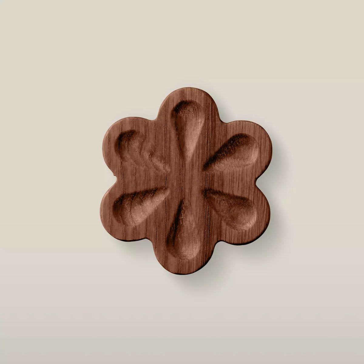 Solid ash carved flower cabinet knob in the Walnut finish, front view