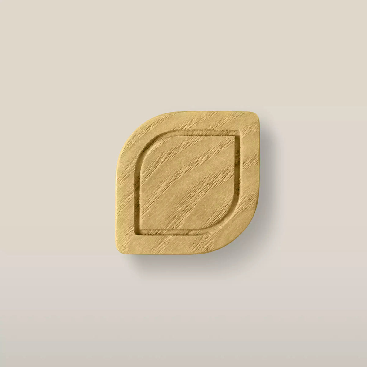 Solid ash framed leaf cabinet knob in the Cream finish, front view