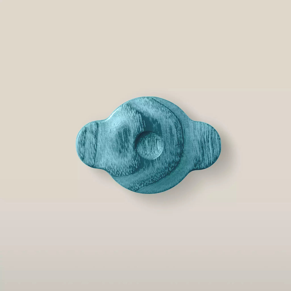 Solid ash swirl cabinet knob in the Blue finish, front view