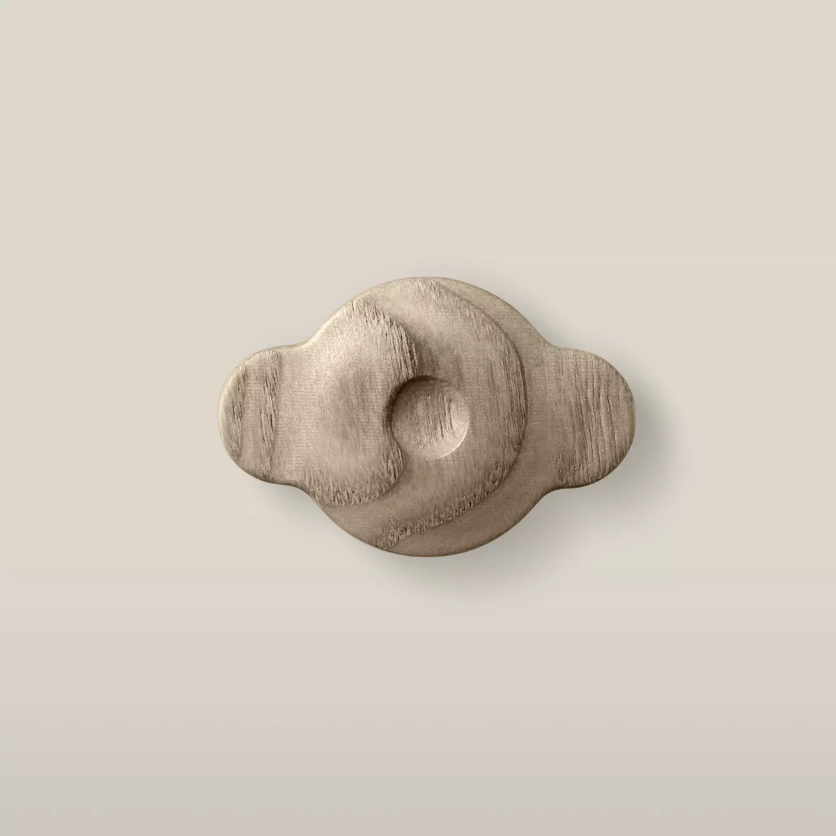 Solid ash swirl cabinet knob in the Cappuccino finish, front view