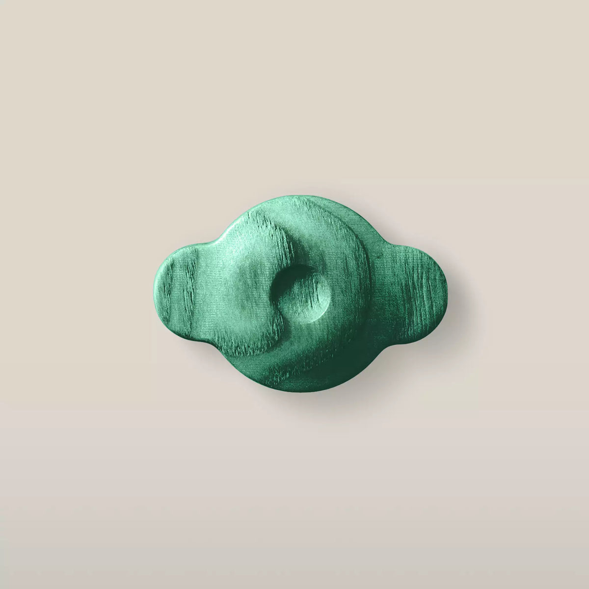 Solid ash swirl cabinet knob in the Green finish, front view