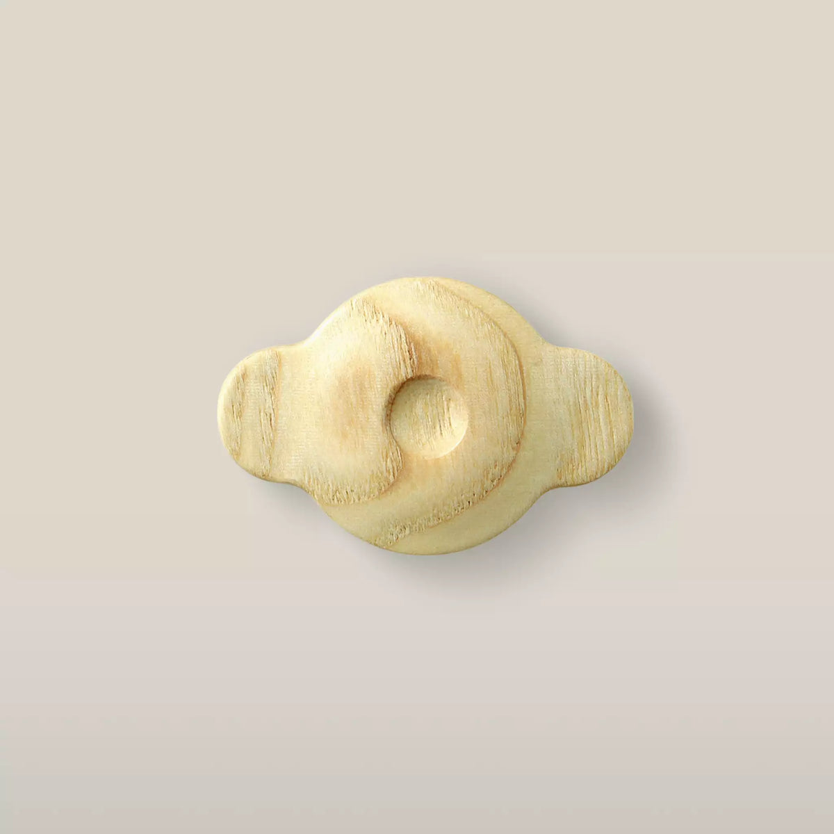 Solid ash swirl cabinet knob in the Latte finish, front view