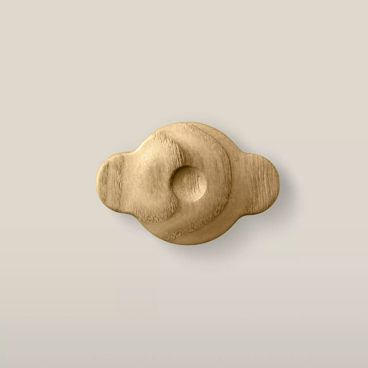Solid ash swirl cabinet knob in the Oiled finish, front view