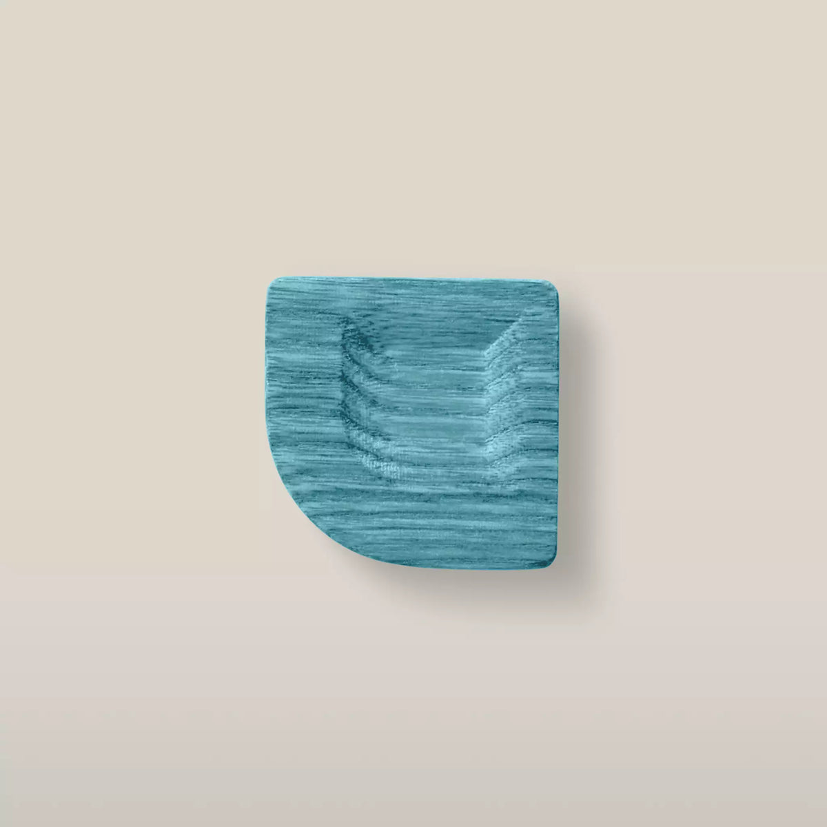 Solid ash scooped square cabinet knob in the Blue finish, front view