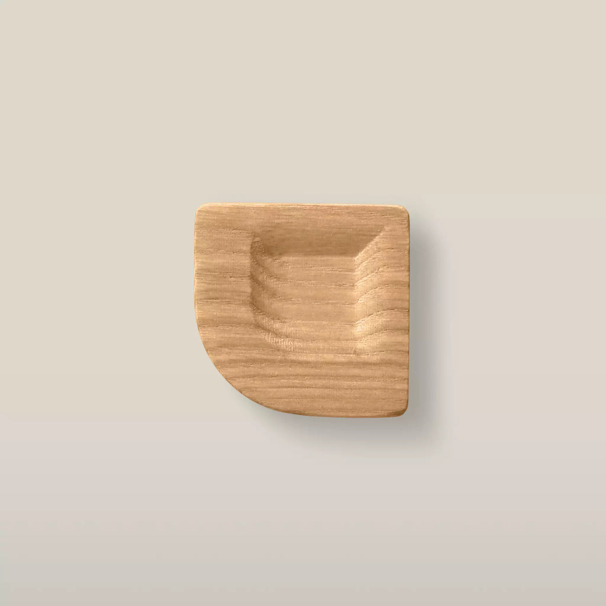 Solid ash scooped square cabinet knob in the Caffe Latte finish, front view