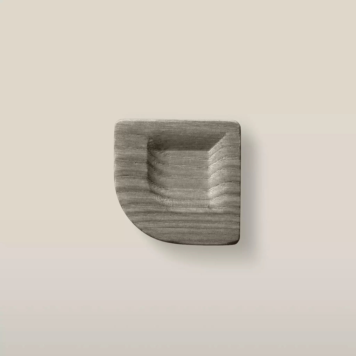 Solid ash scooped square cabinet knob in the Dark Gray finish, front view