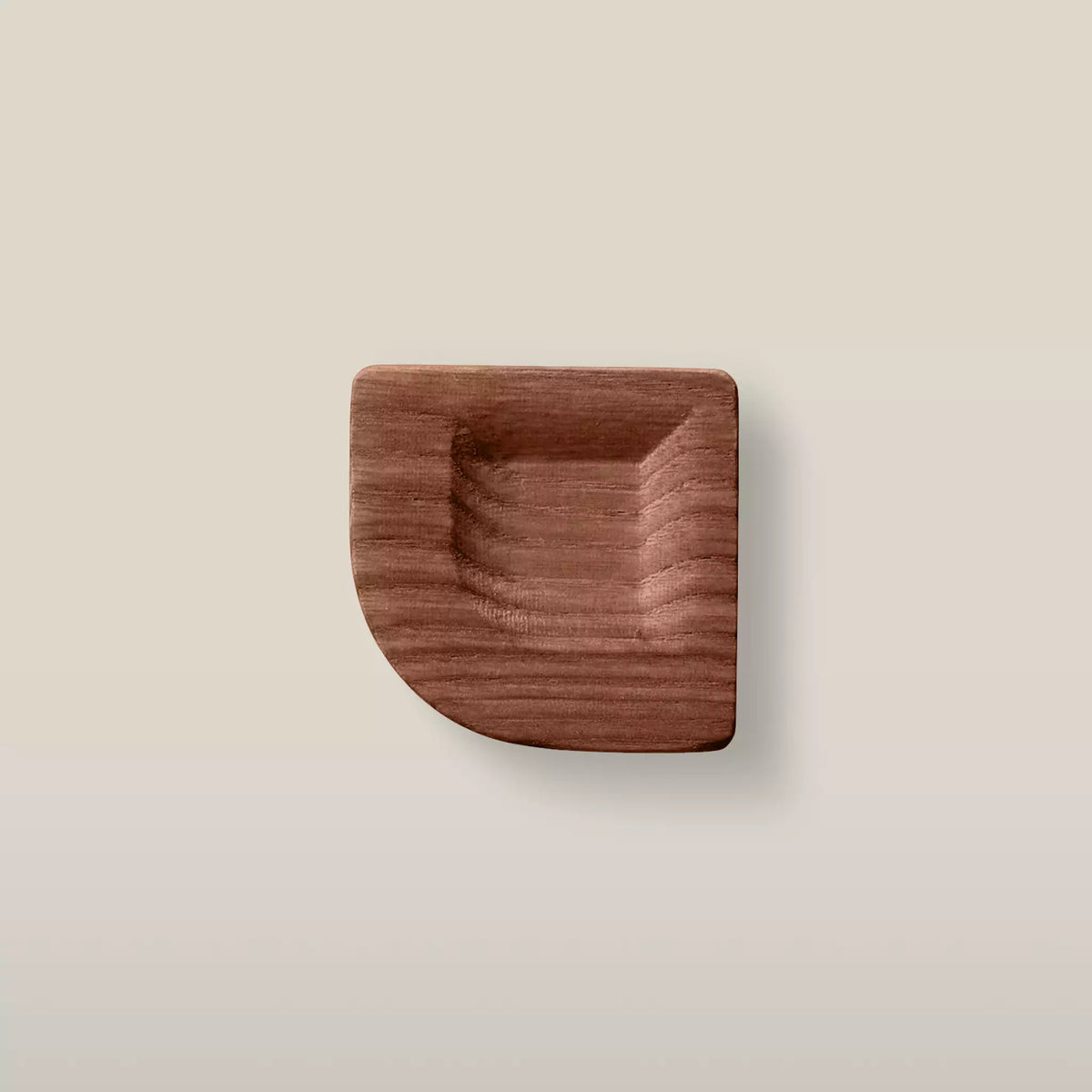 Solid ash scooped square cabinet knob in the Walnut finish, front view