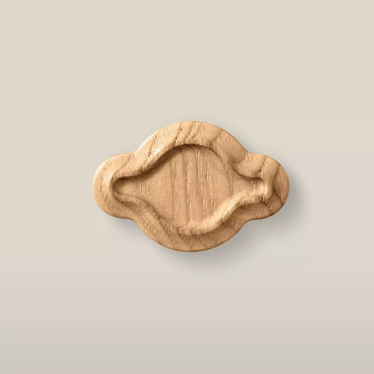 Solid ash scalloped oval cabinet knob in the Caffe Latte finish, front view