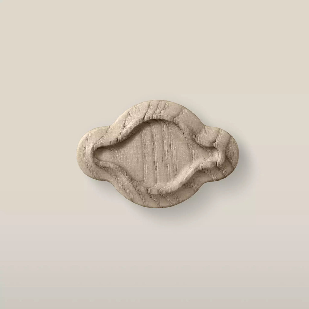 Solid ash scalloped oval cabinet knob in the Cappuccino finish, front view