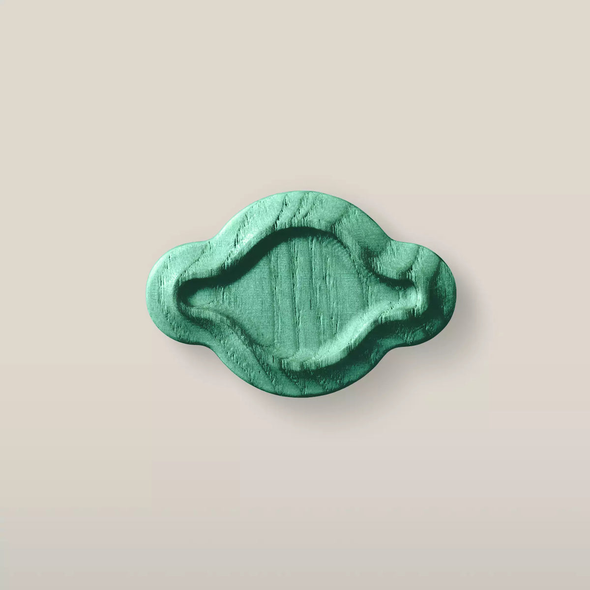 Solid ash scalloped oval cabinet knob in the Green finish, front view