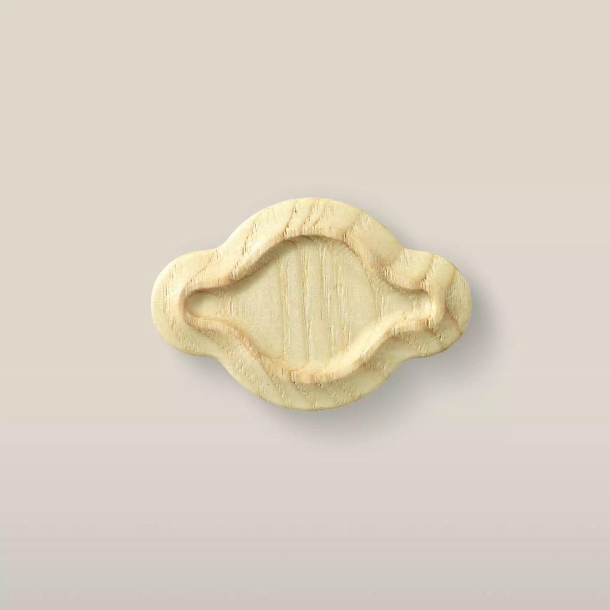 Solid ash scalloped oval cabinet knob in the Latte finish, front view