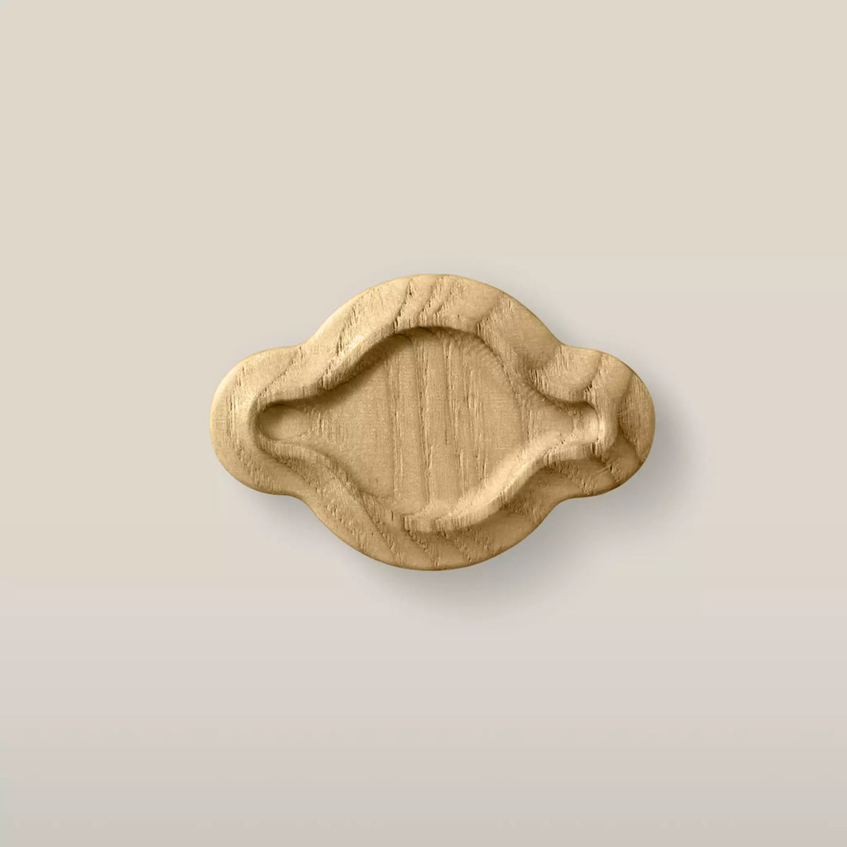 Solid ash scalloped oval cabinet knob in the Oiled finish, front view