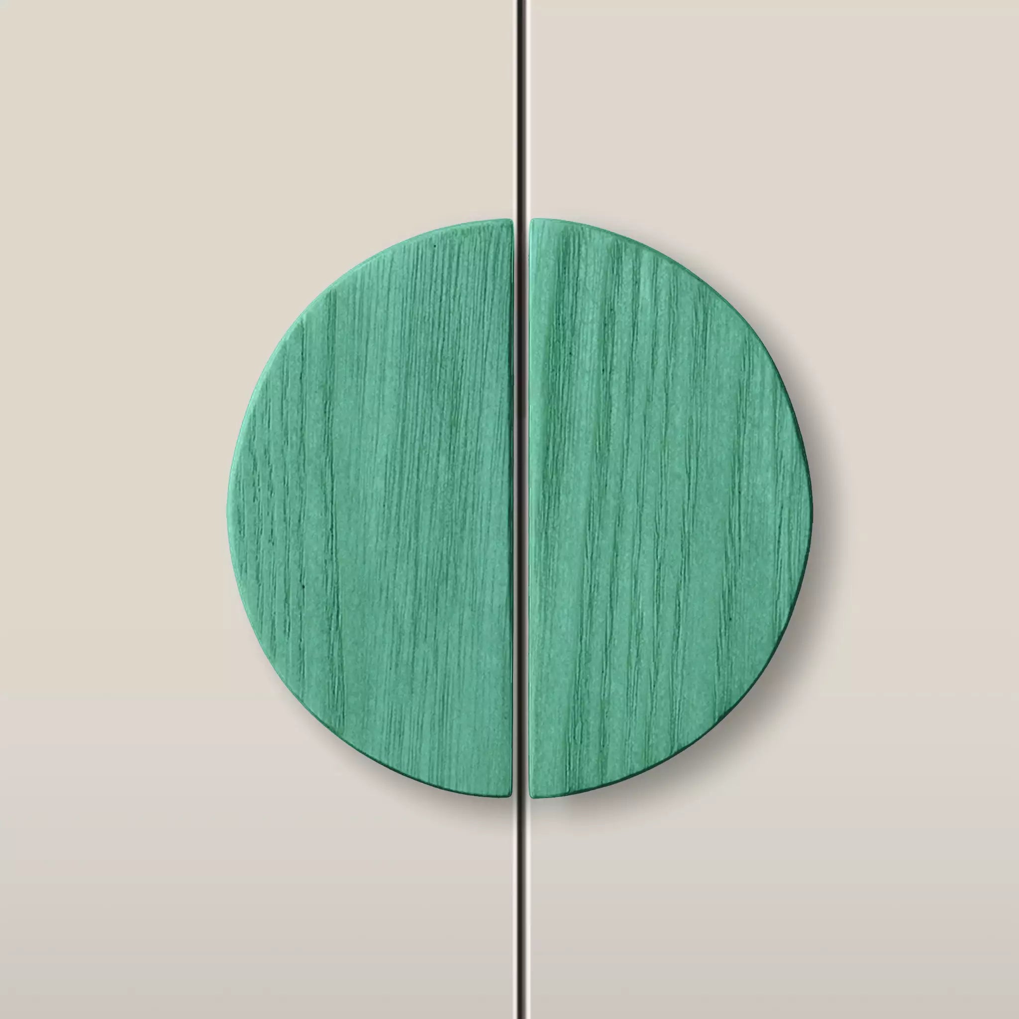 Solid ash half moon cabinet pull in the Green finish, fitted across two doors