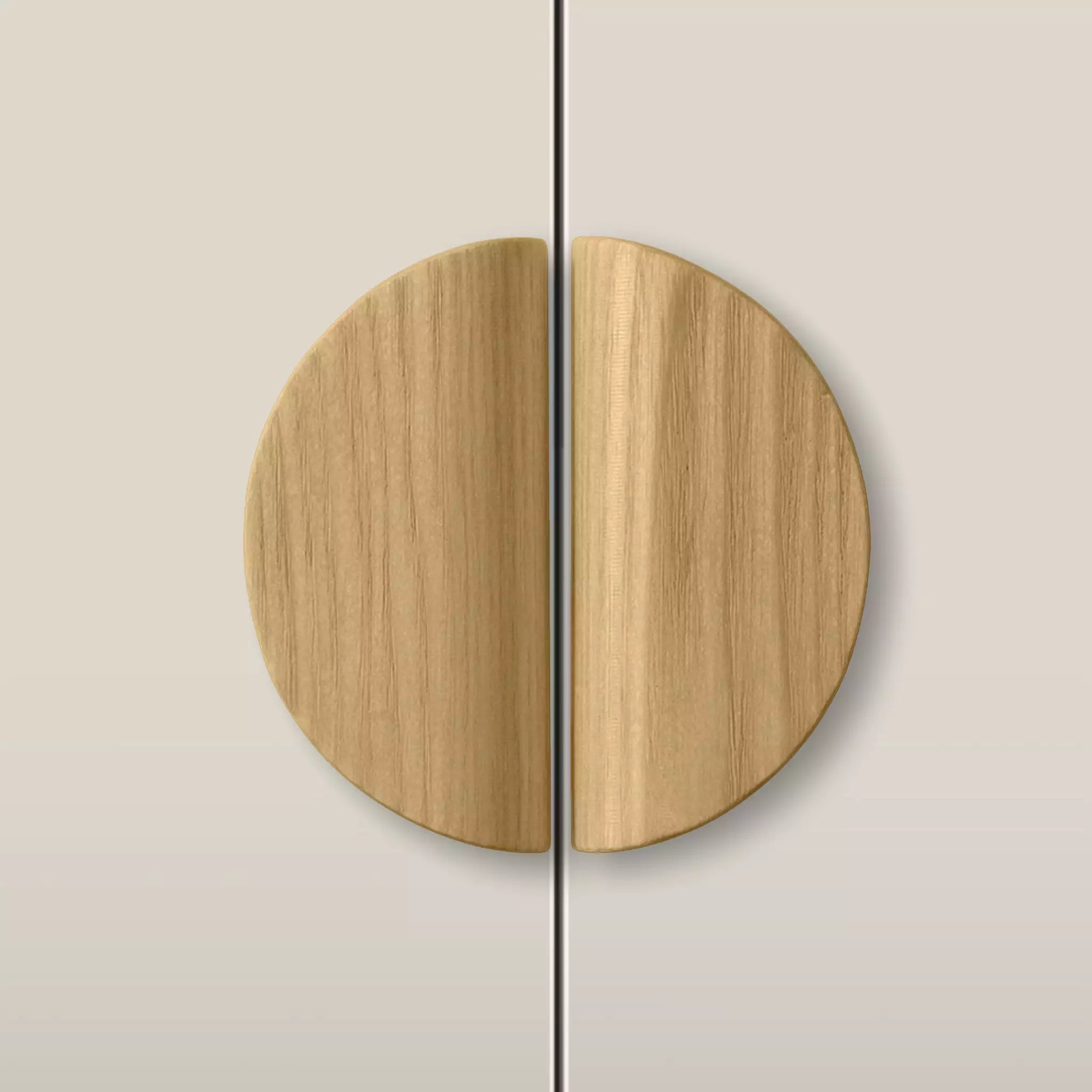 Solid ash dome cabinet pull in the Oiled finish, fitted across two doors