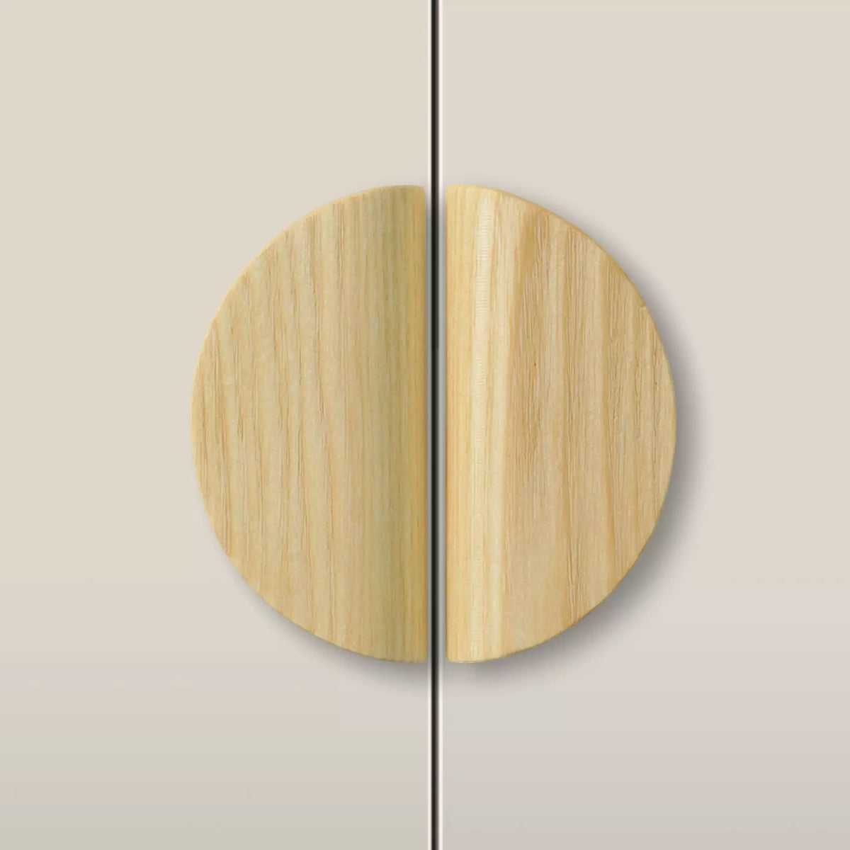 Solid ash dome cabinet pull in the Unfinished finish, fitted across two doors
