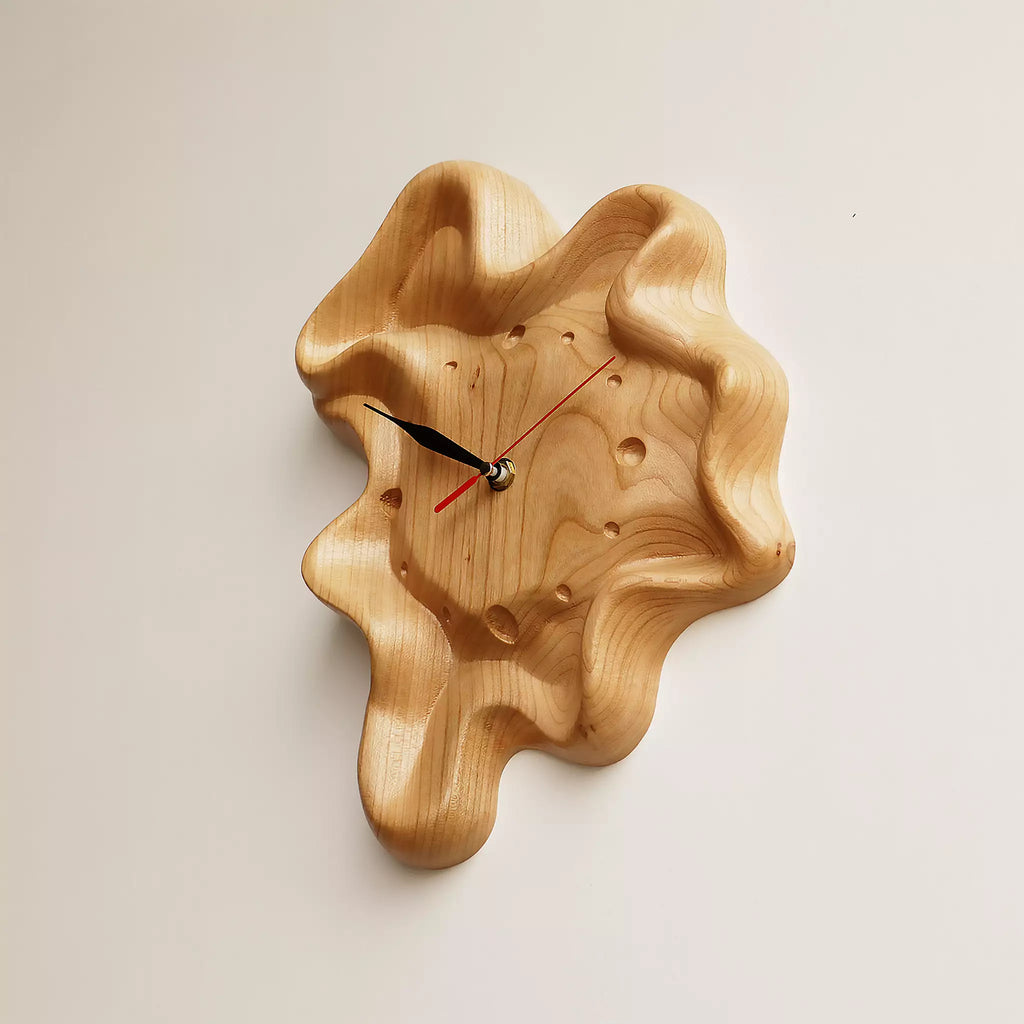 The clock from the side, showing the rippled rim standing away from the wall