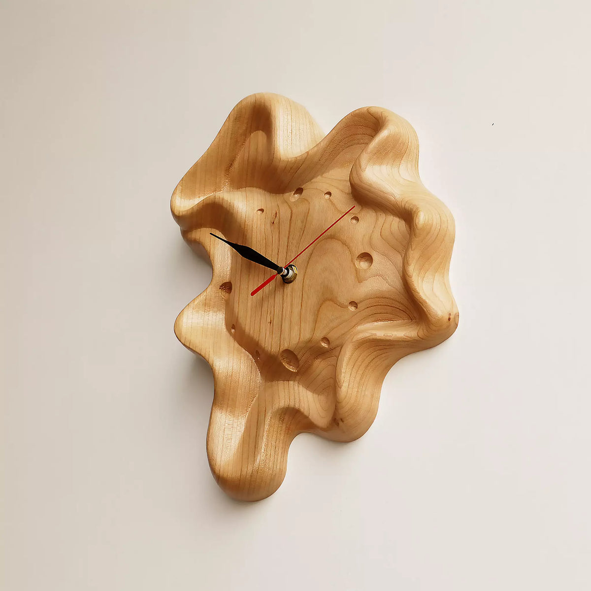The clock from the side, showing the rippled rim standing away from the wall