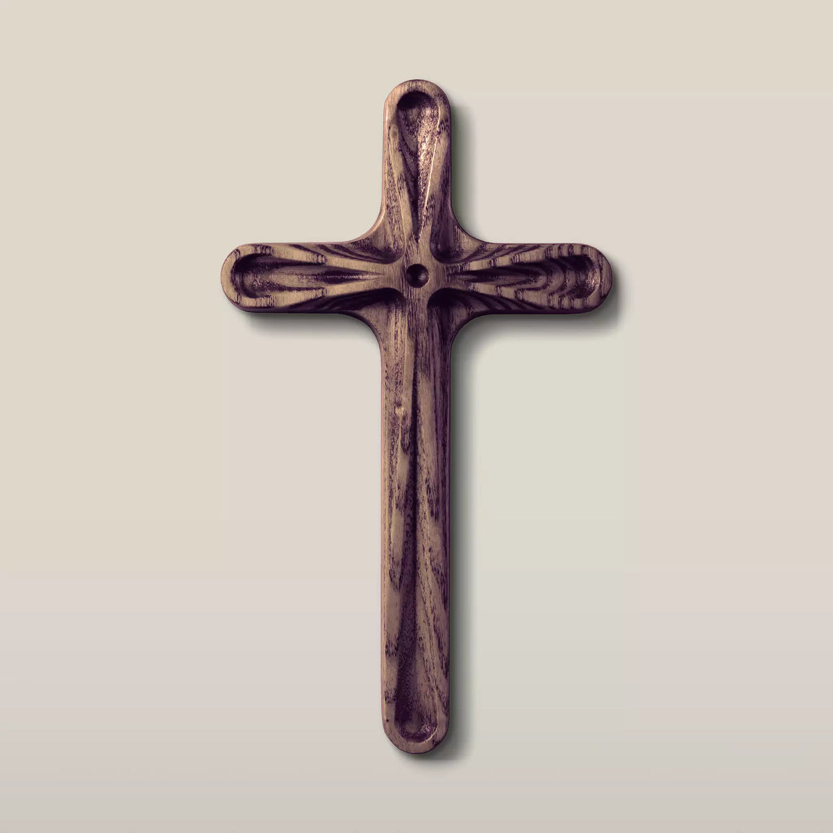 The cross in the walnut finish, dark brown with the ash grain still visible underneath