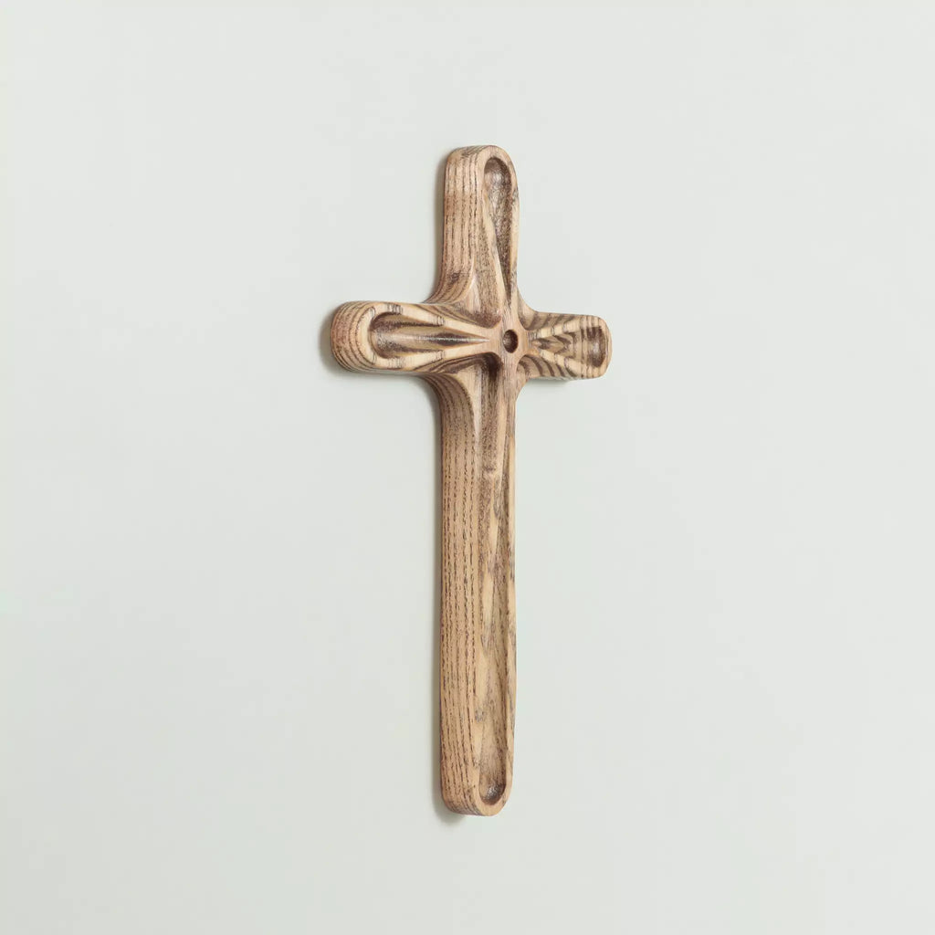The back of the cross seen at an angle, with the keyhole fixing visible