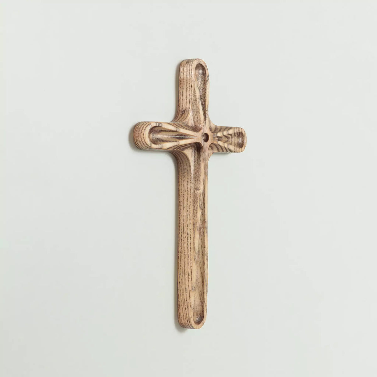 The back of the cross seen at an angle, with the keyhole fixing visible