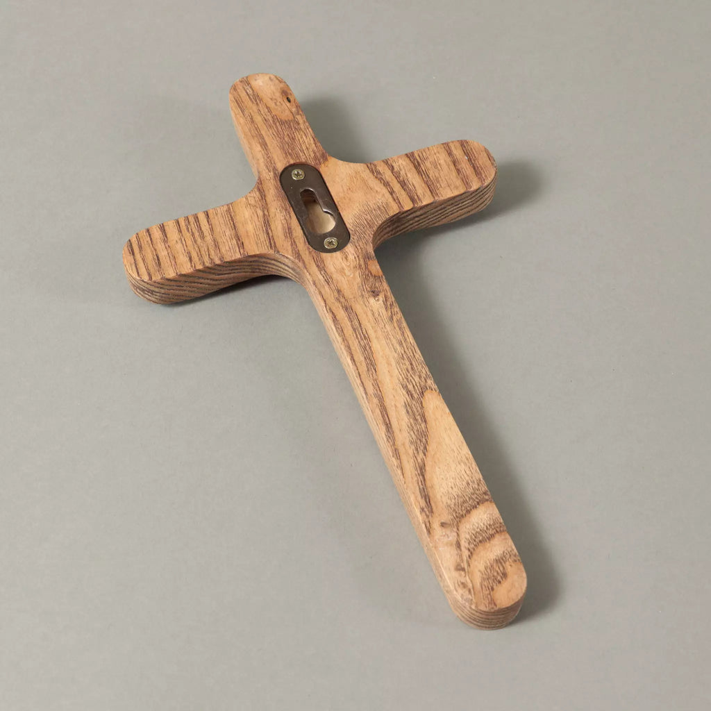 The back of the cross, showing the keyhole plate recessed for wall mounting